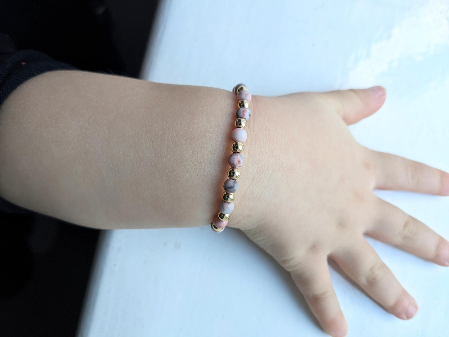 Pink stone and gold plated