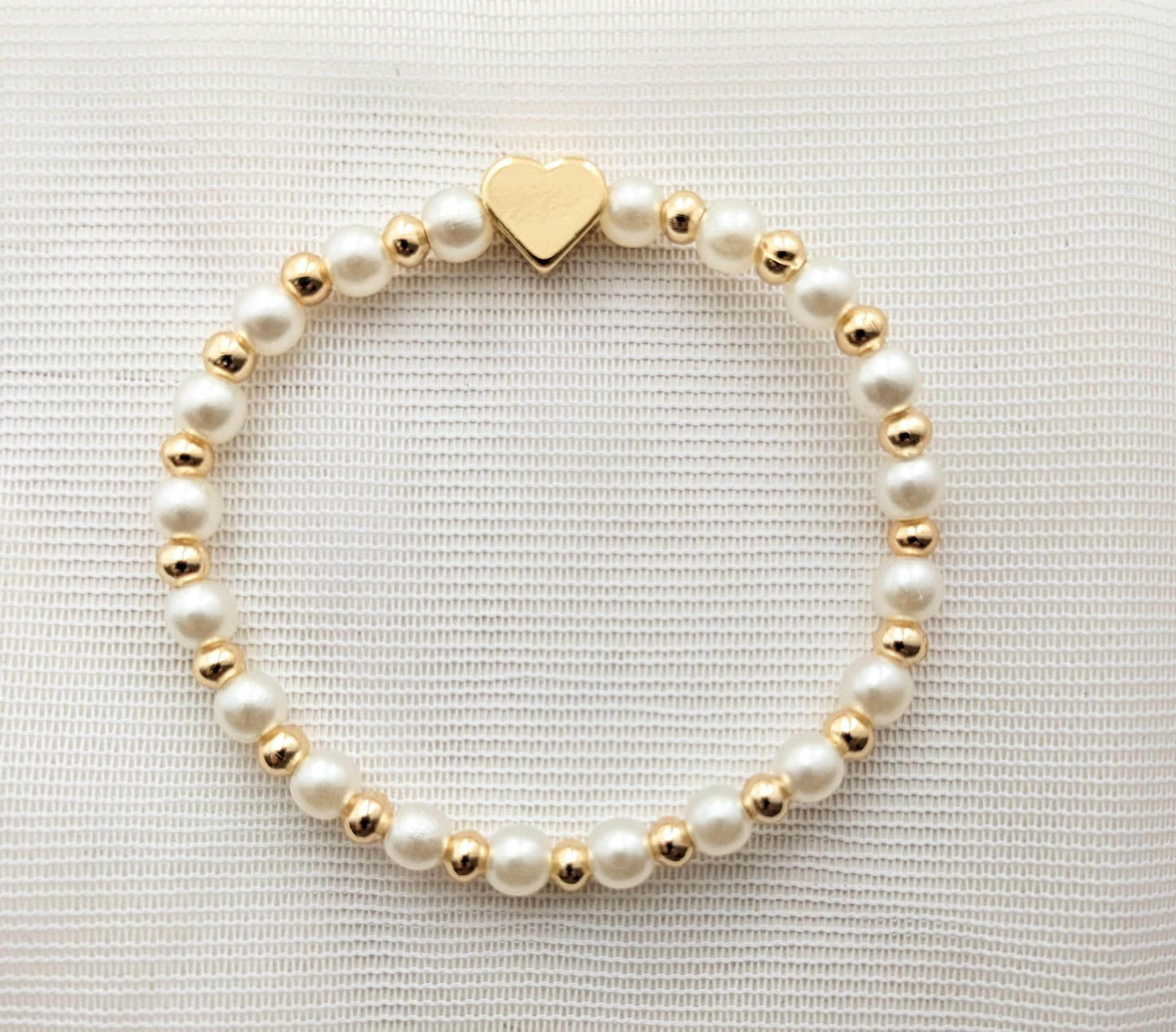 Pearls and gold plated heart