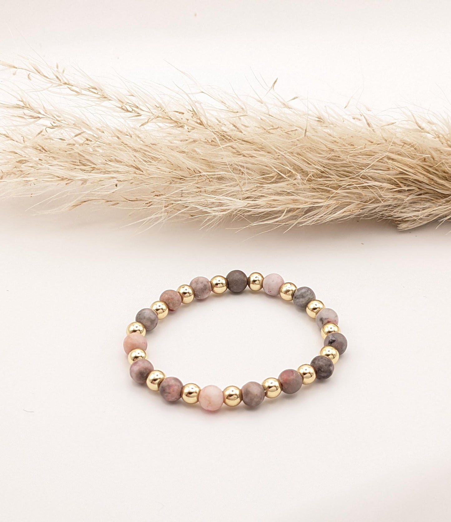 Pink stone and gold plated