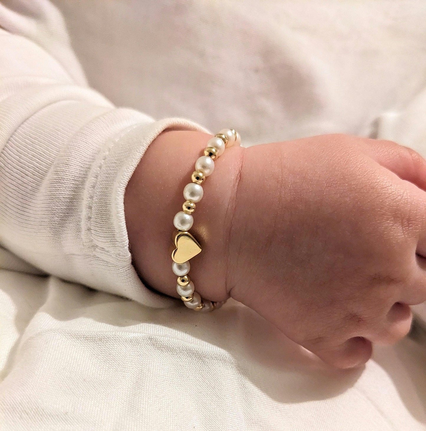 Pearls and gold plated heart