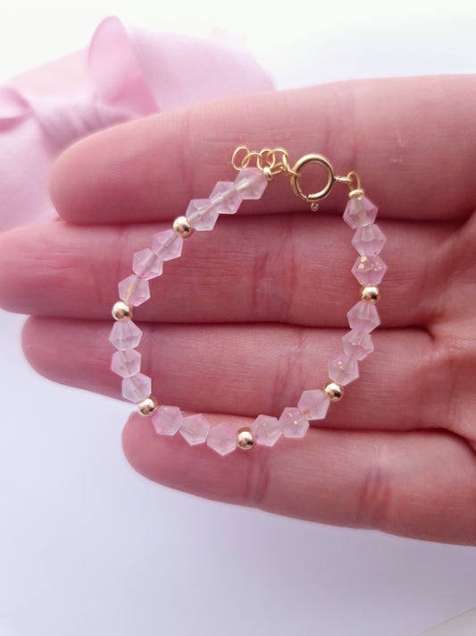 Gold filled pink crystals