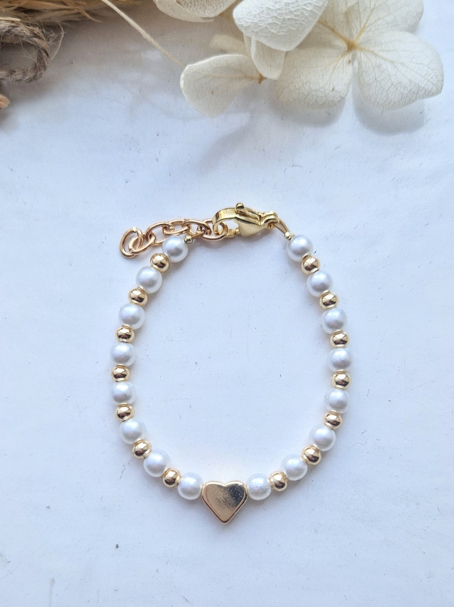 Pearls and gold plated heart