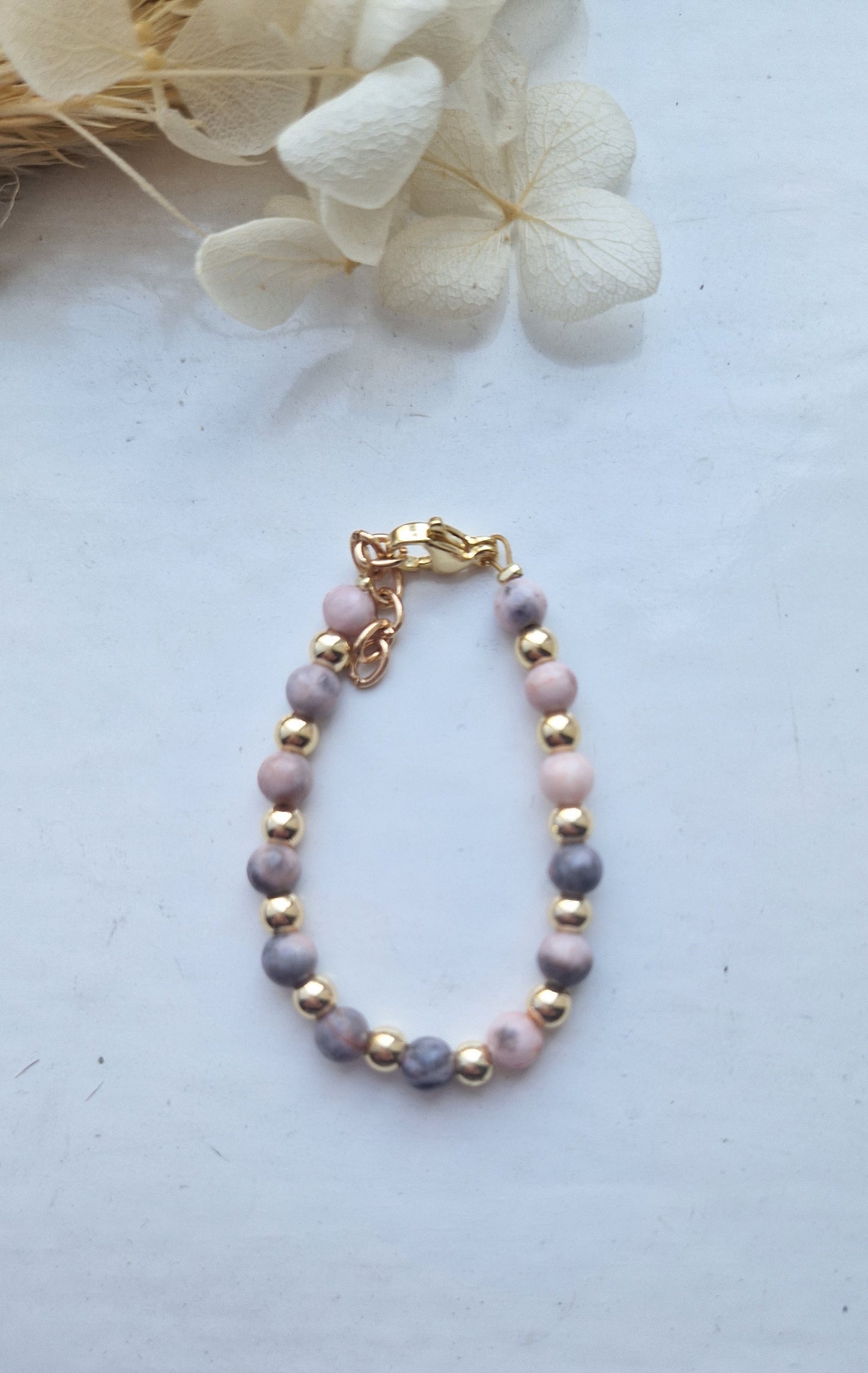 Pink stone and gold plated
